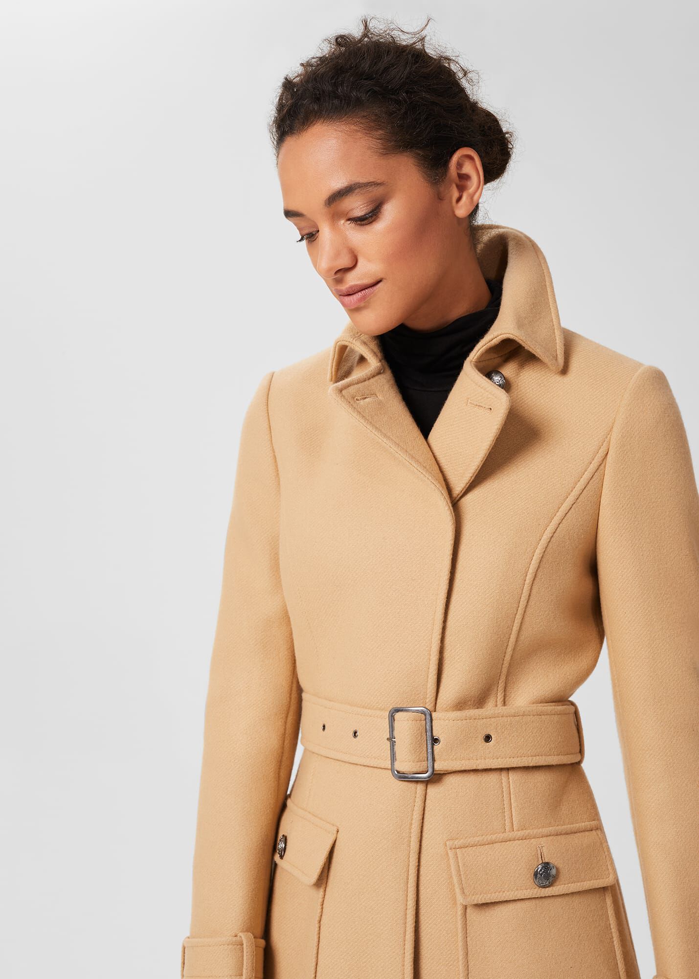 belted tan coat