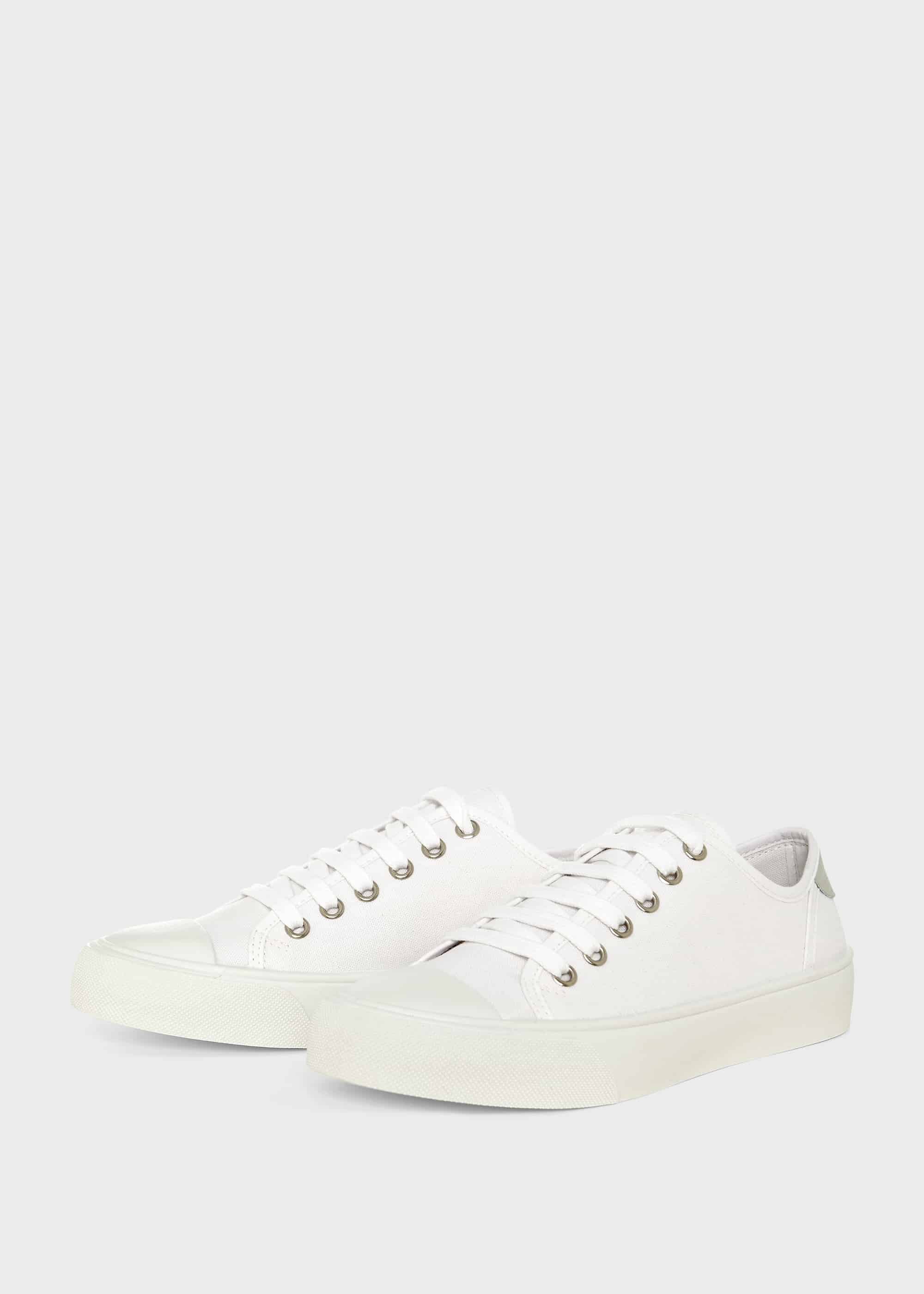 white fabric trainers