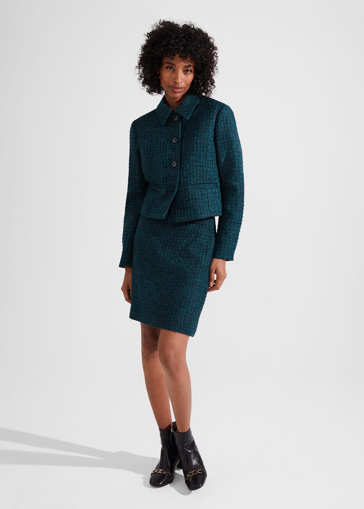 Tweed skirt suit green top
