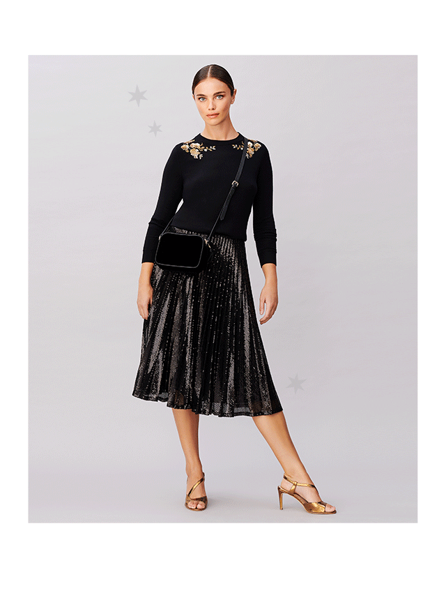 Model wears an embellished jumper and sequin skirt from Hobbs.