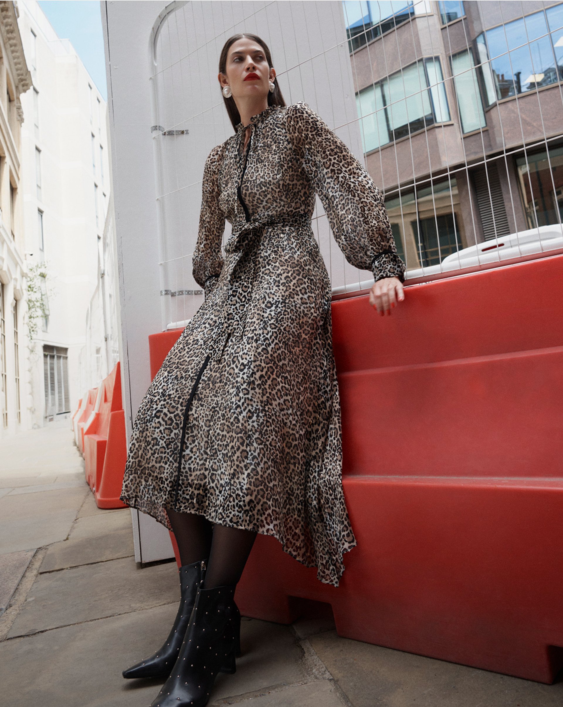 A woman wearing a Hobbs trench coat.
