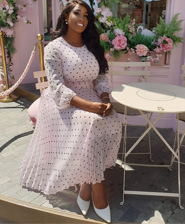 Image consultant woman_ofelegance photographed at a cafe wearing Hobbs' Selena pink polka dot dress.