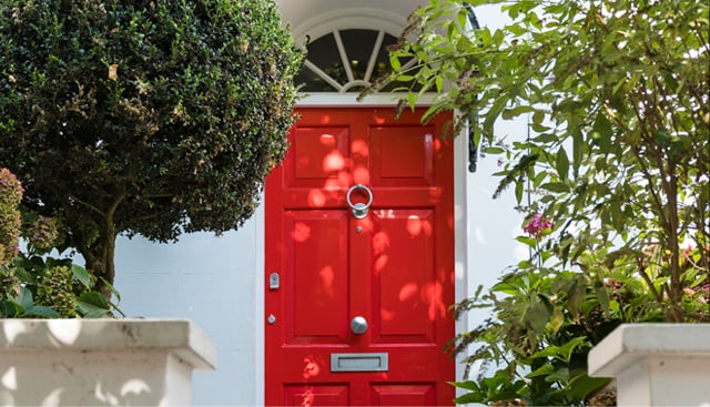 Hobbs at home with a class red london front door. 