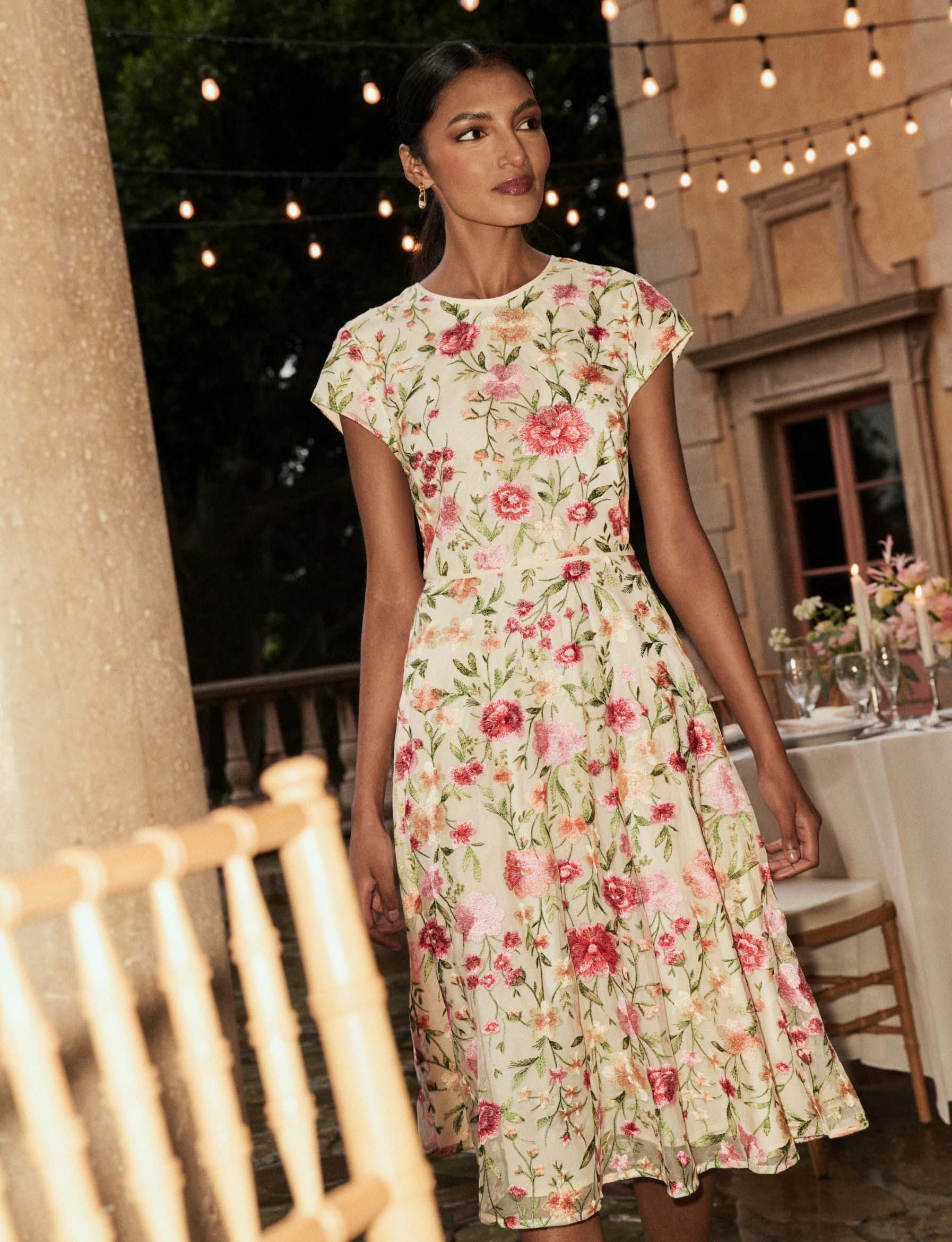MODEL WEARING HOBBS FLORAL OCCASION TIA DRESS