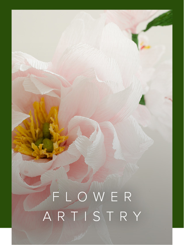 Close-up of a pink paper rose flower, handmade by Emmeli Kimhi.