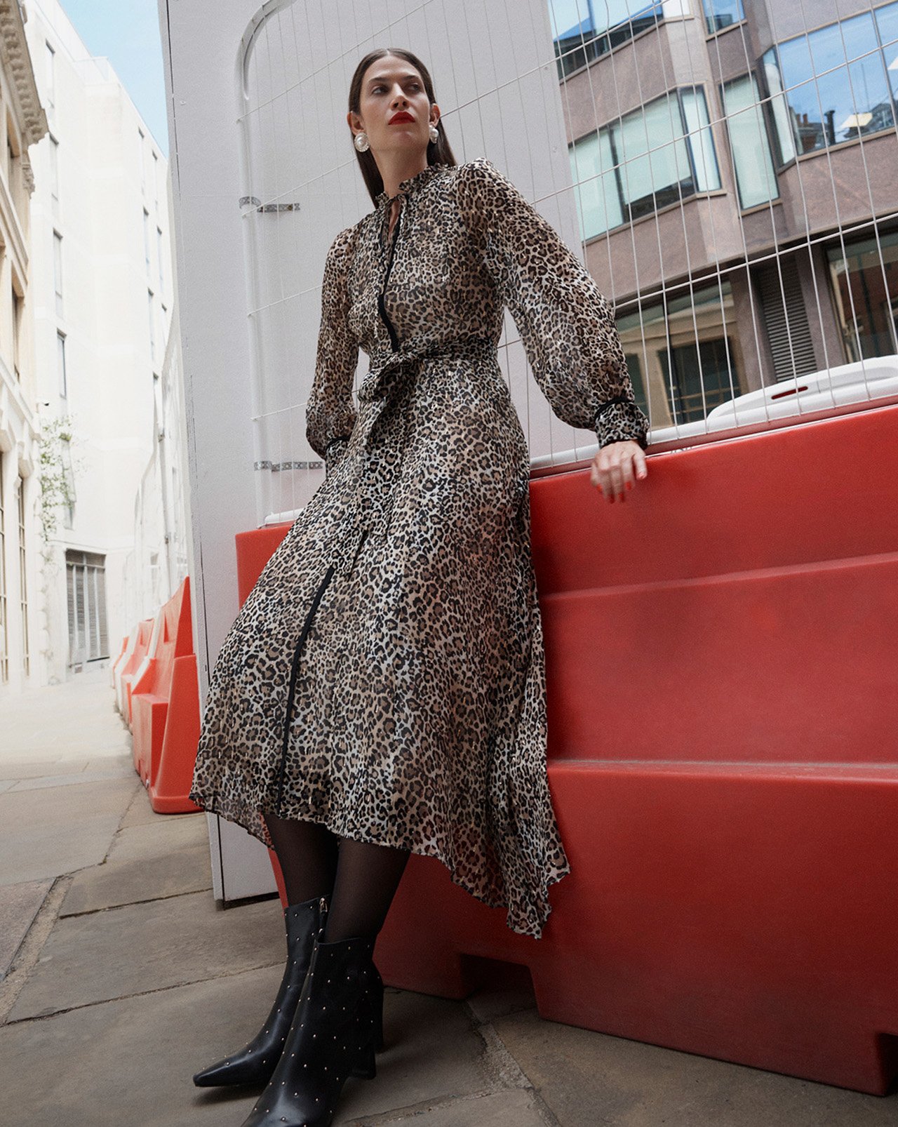 A woman wearing a Hobbs trench coat.