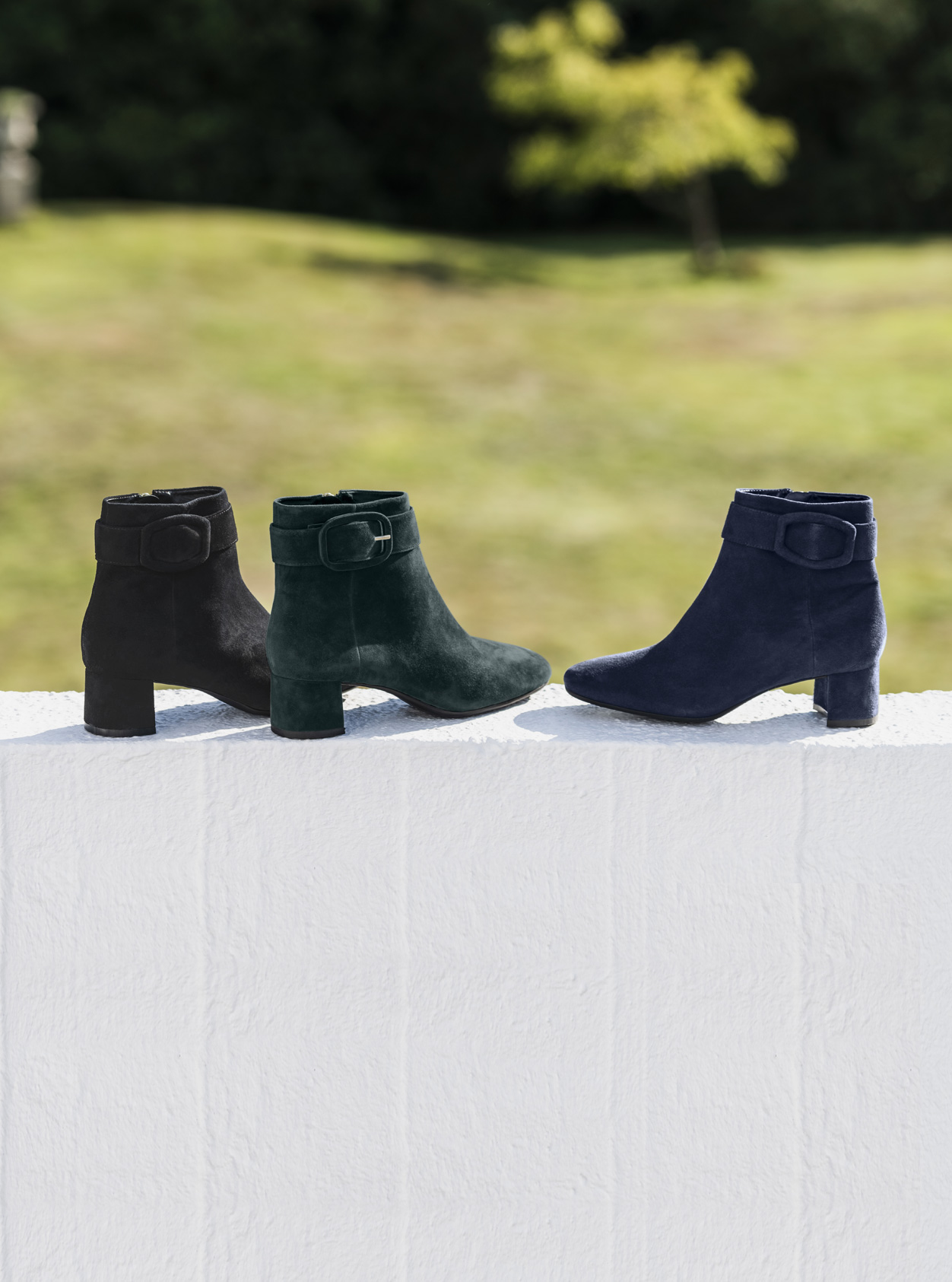 Women’s ankle boots from Hobbs, from left to right: Black, green and blue.