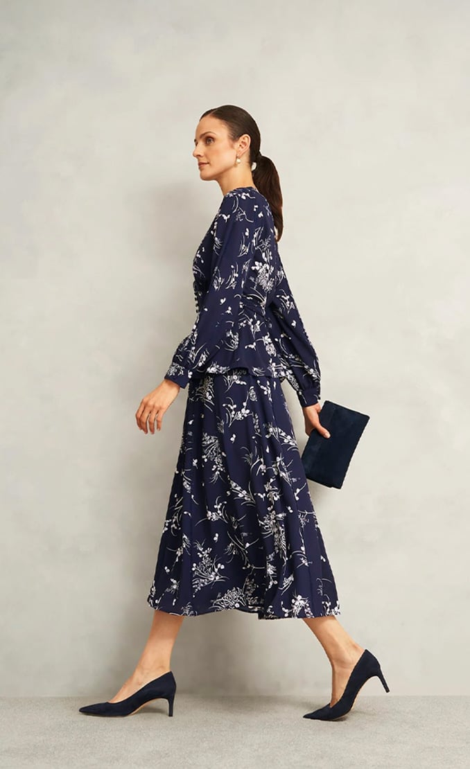 Women wearing Hobbs trend-leaning occasion dresses.