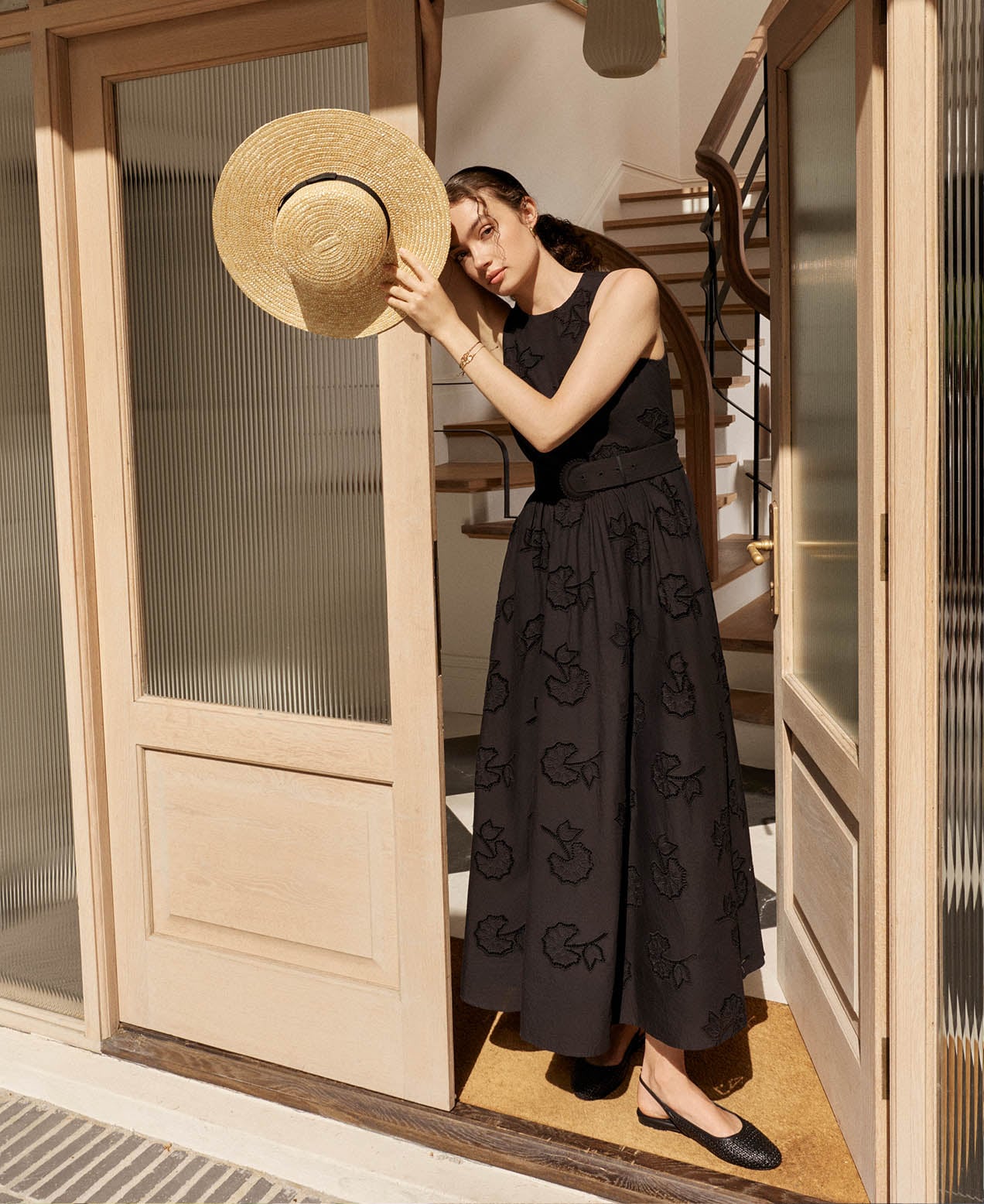A woman wearing a Hobbs black dress