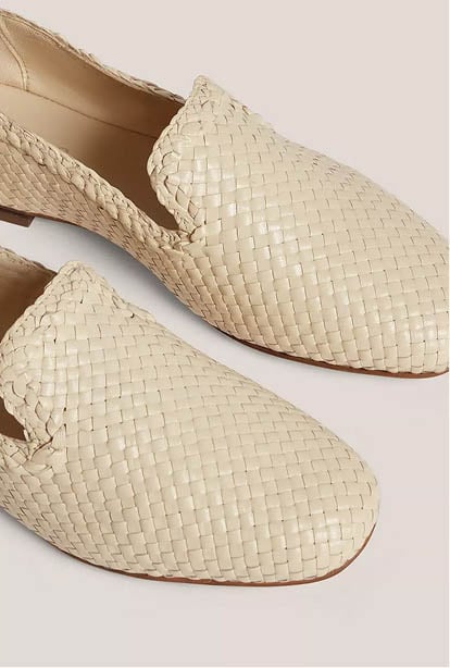 A woman wearing a Hobbs dress.