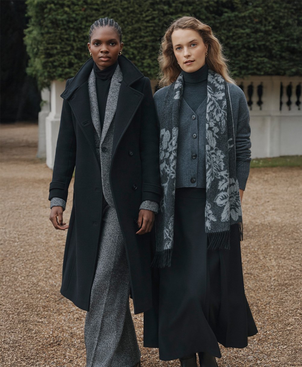 Women wearing grey and black autumn-winter layers.