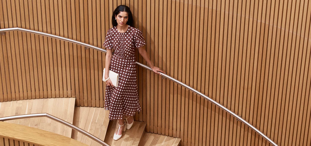 A woman wearing a polka dot dress.