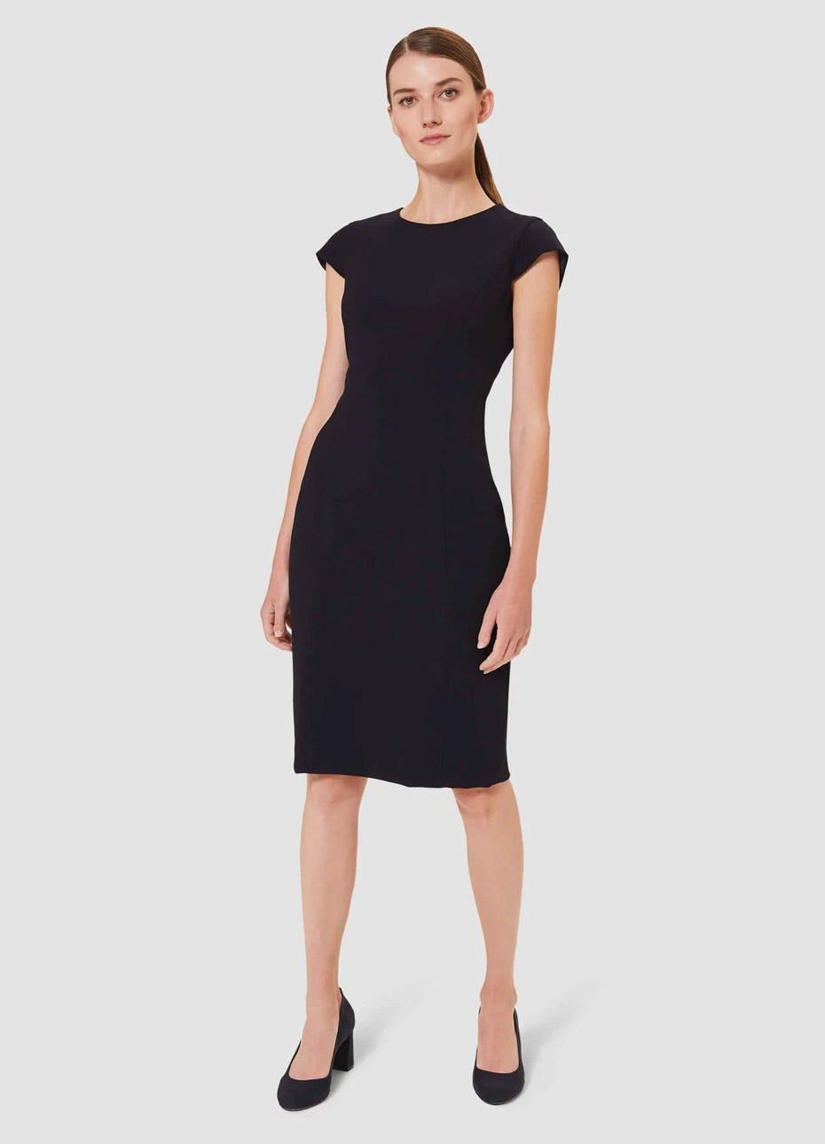 Black shift dress worn with block heeled court shoes in black, by Hobbs.