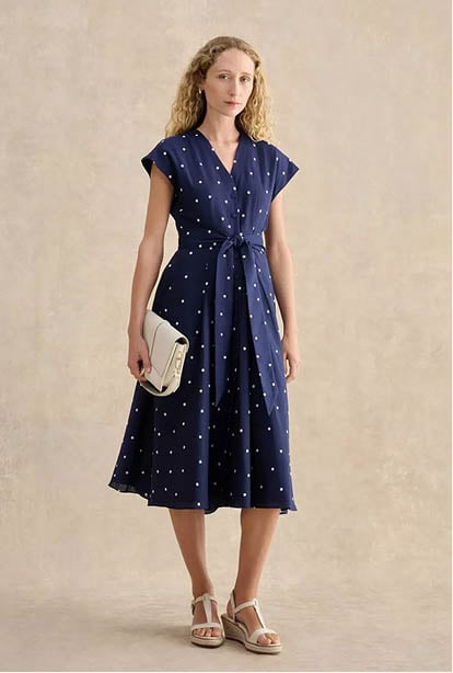 A woman wearing a Hobbs dress.