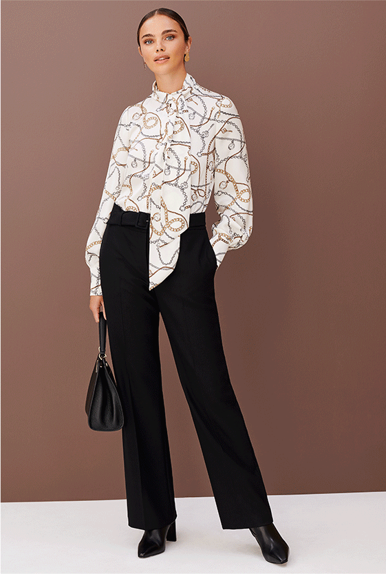 Hobbs Beatrice Cream Chain Print Blouse styled with tailored black work trousers, leather heeled ankle boots and a black leather handbag 