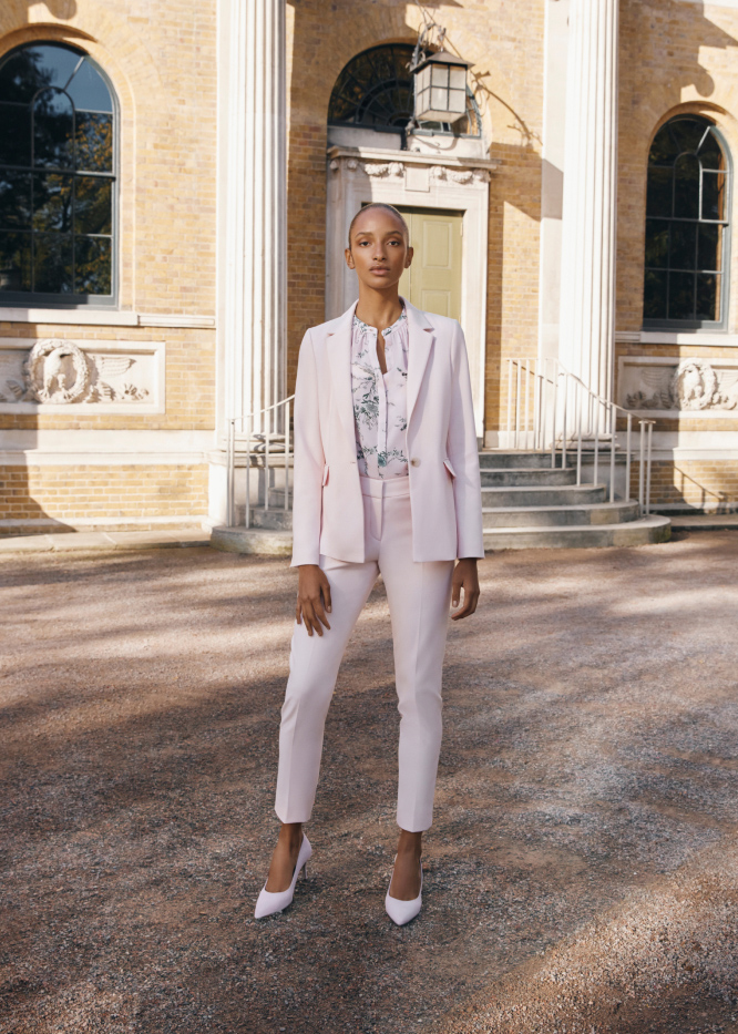Gallery of four images showing models wearing wedding guest outfits.