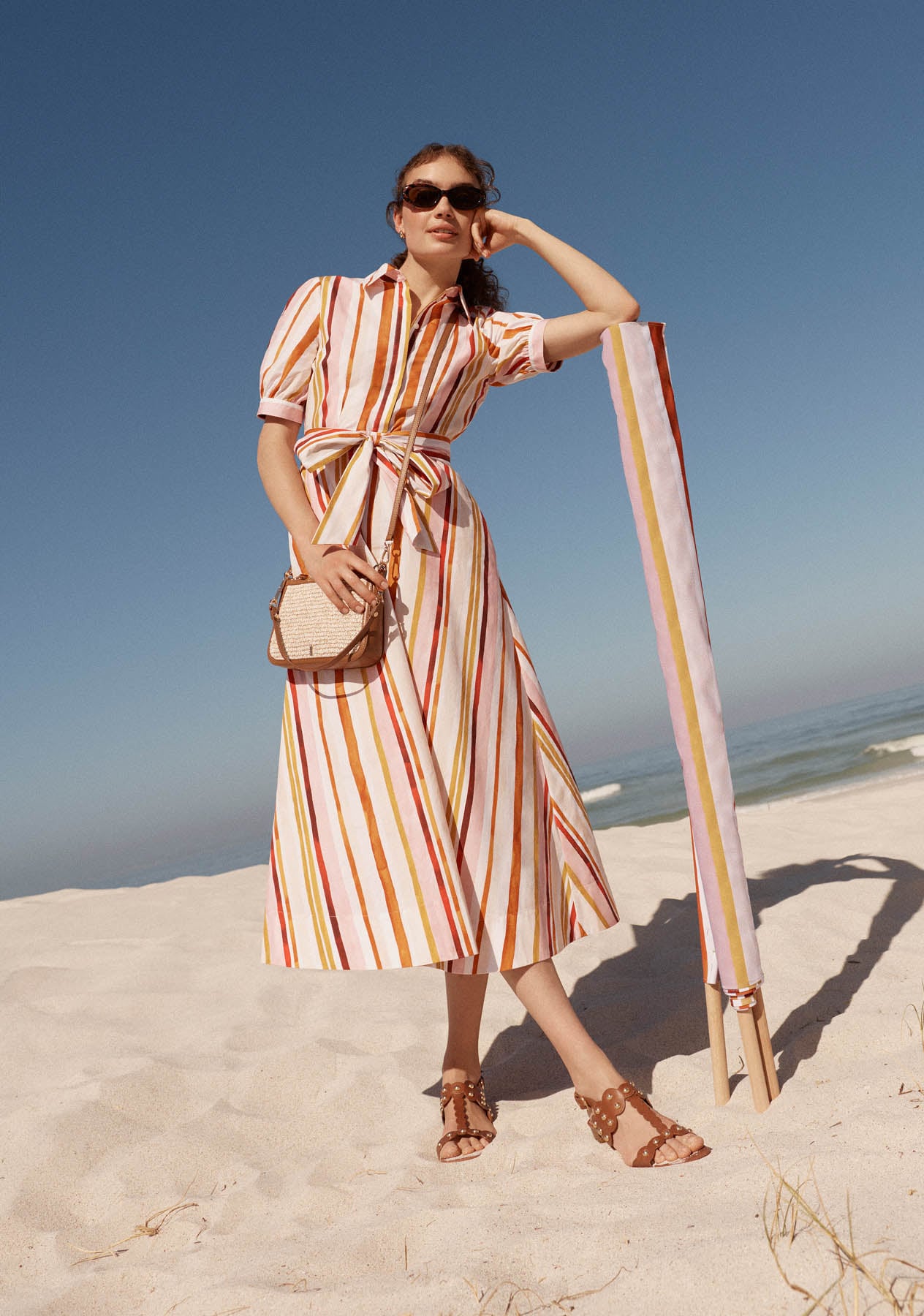 Women wearing Hobbs printed summer clothes.
