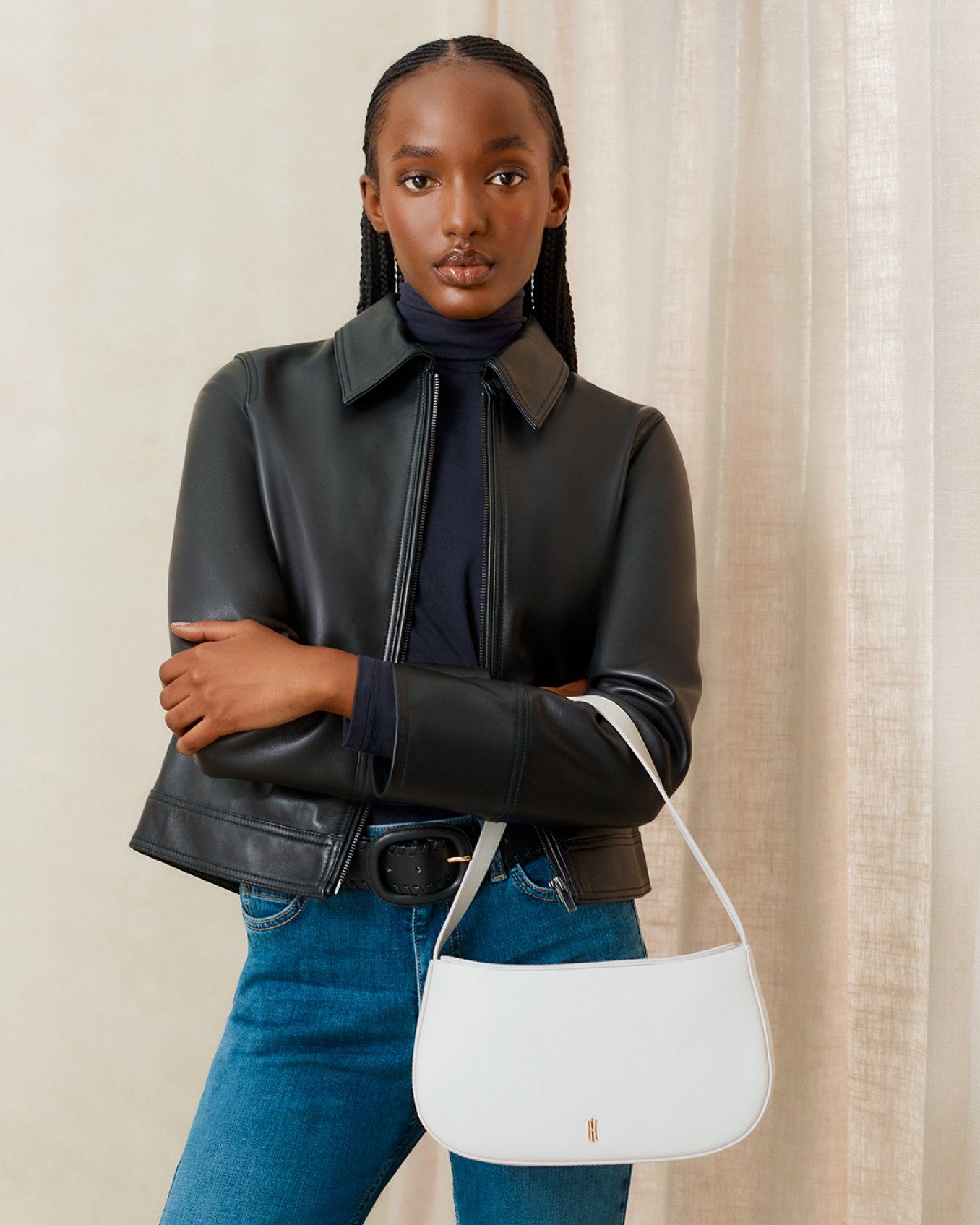 Hobbs model wears a black leather collared jacket