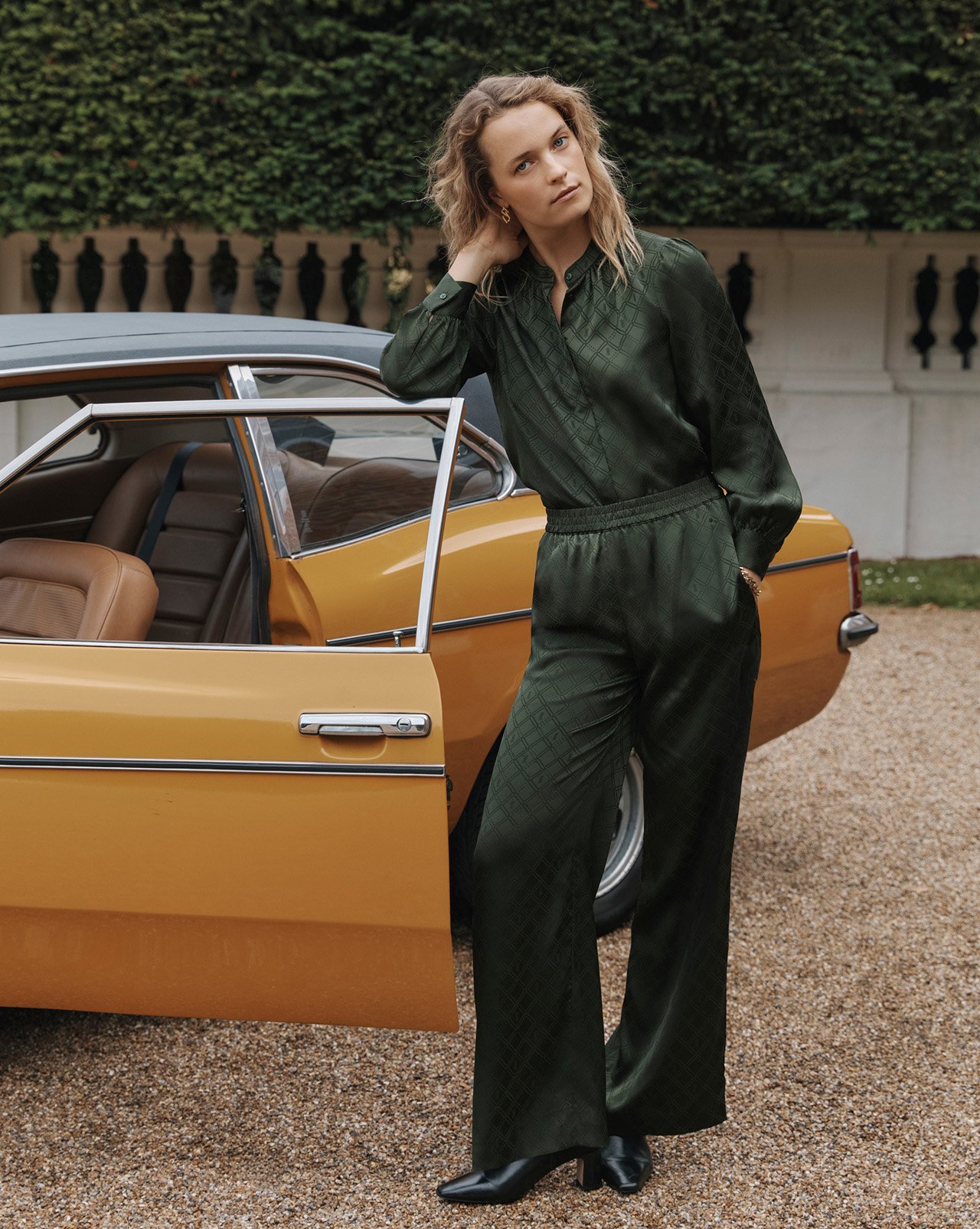 A woman wearing a Hobbs trench coat.