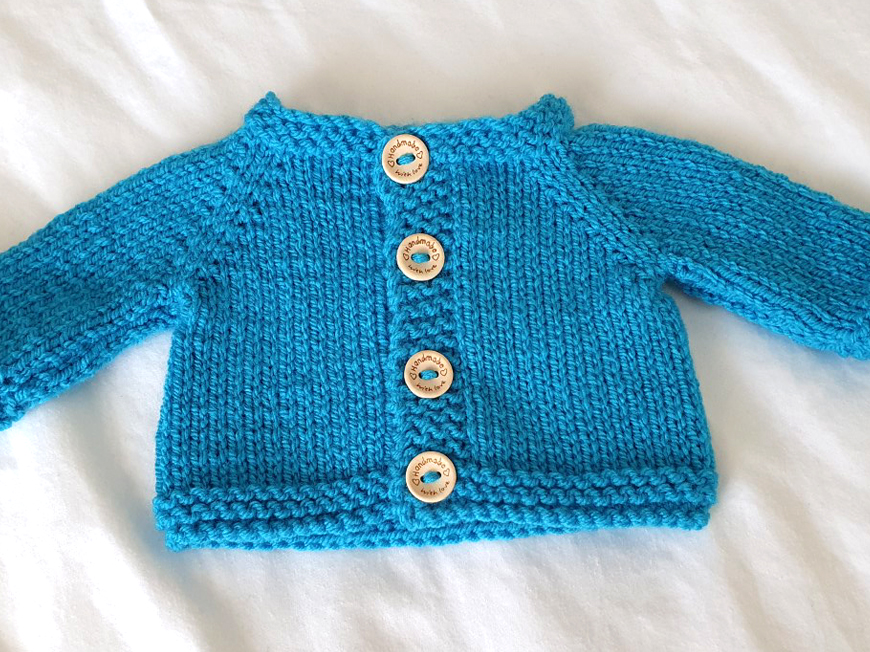 Blue, aqua and pink cardigans created for charity