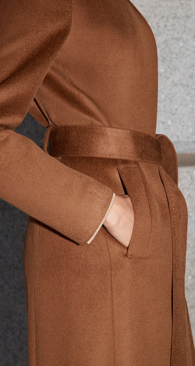 A woman wearing a Hobbs wool coat.