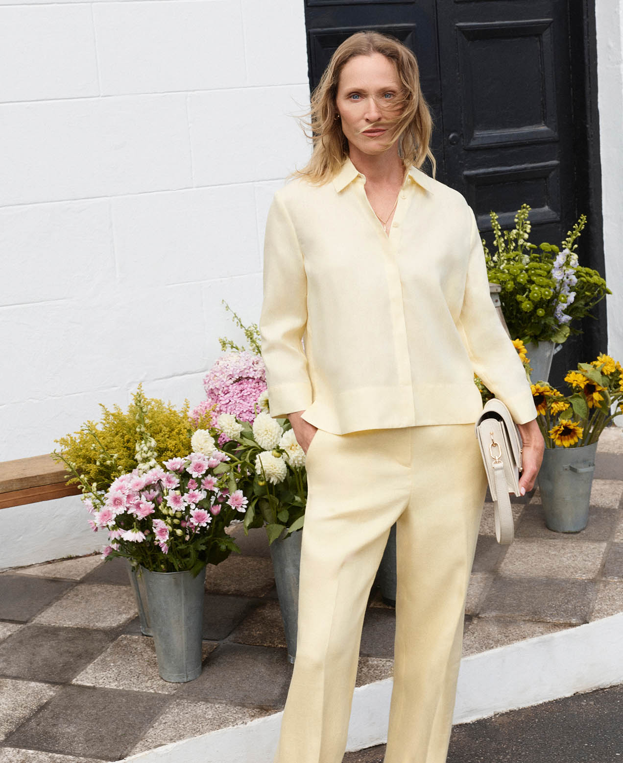 A woman wearing a Hobbs linen suit.