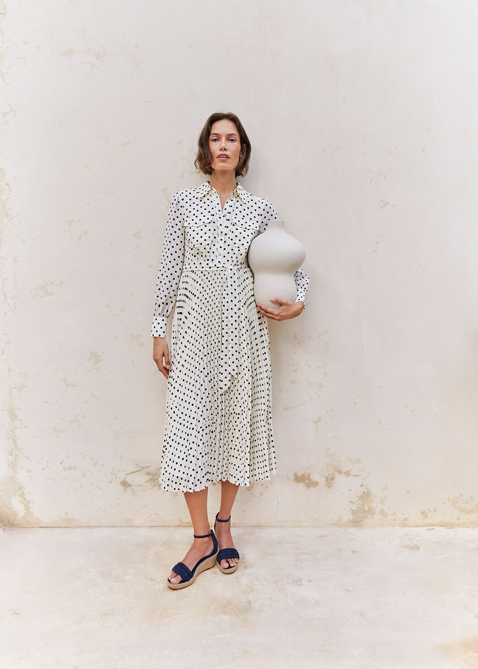 An image of a model wearing a Hobbs’ polka dot dress.