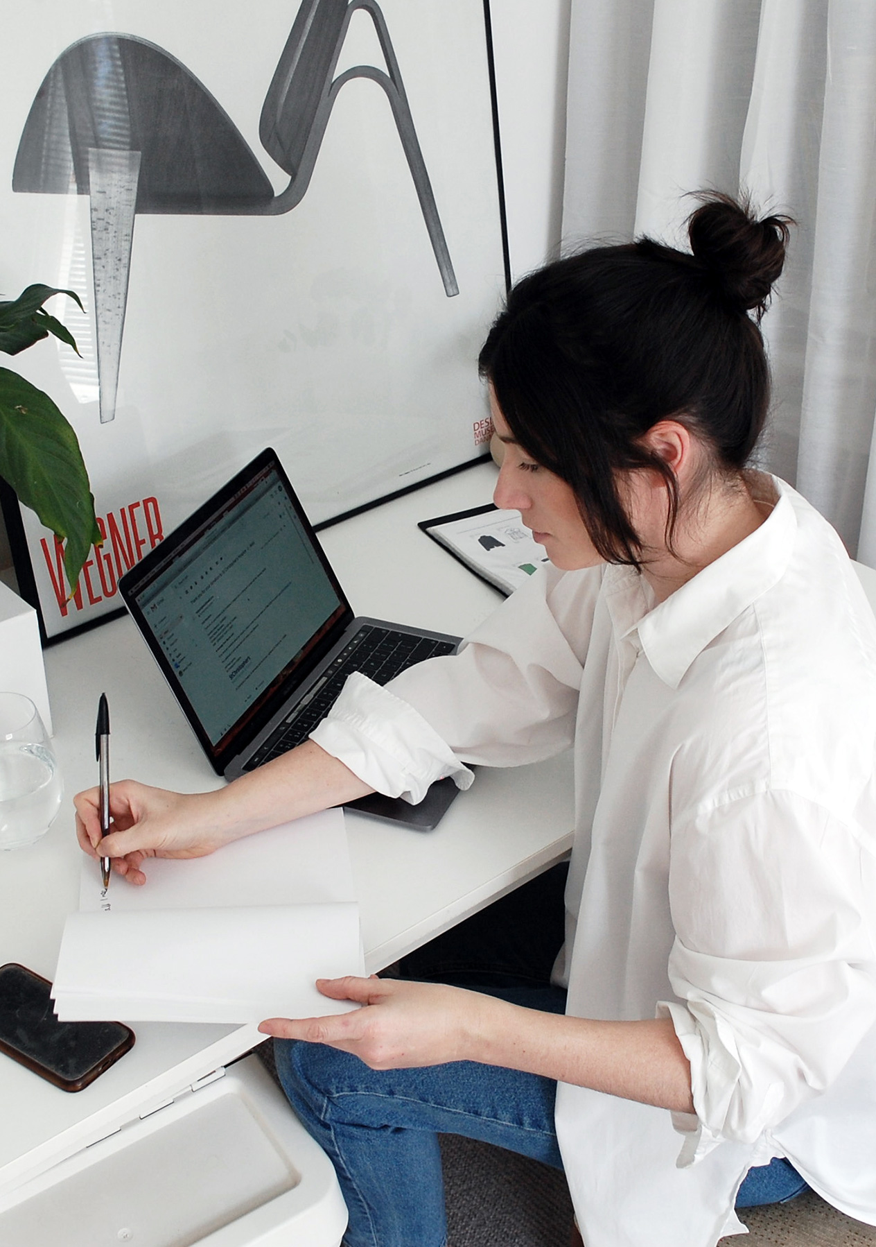 Maddy, Hobbs Brand Stylist sits working from home at her laptop