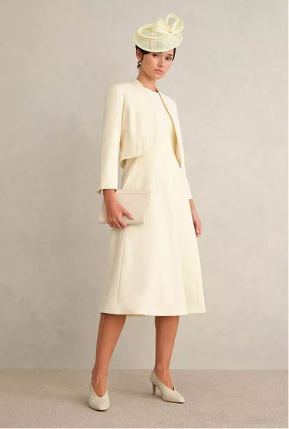 A woman wearing a Hobbs dress.