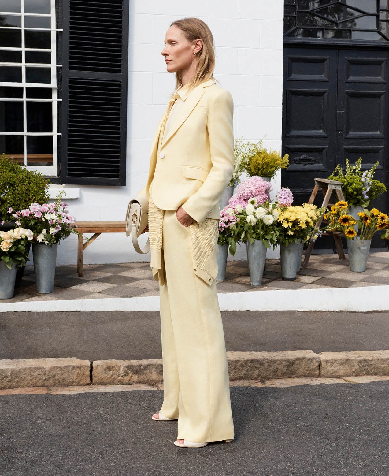 A woman wearing a Hobbs linen suit.