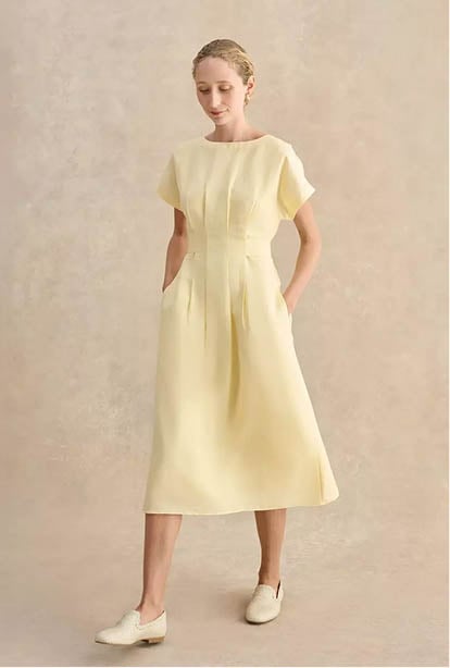 A woman wearing a Hobbs dress.