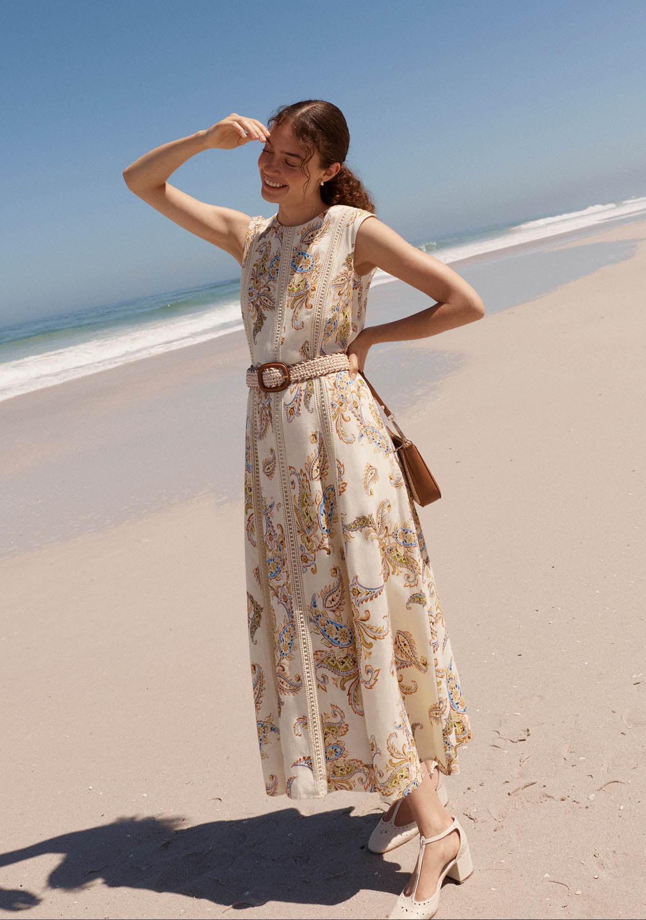 A woman wearing a Hobbs paisley dress