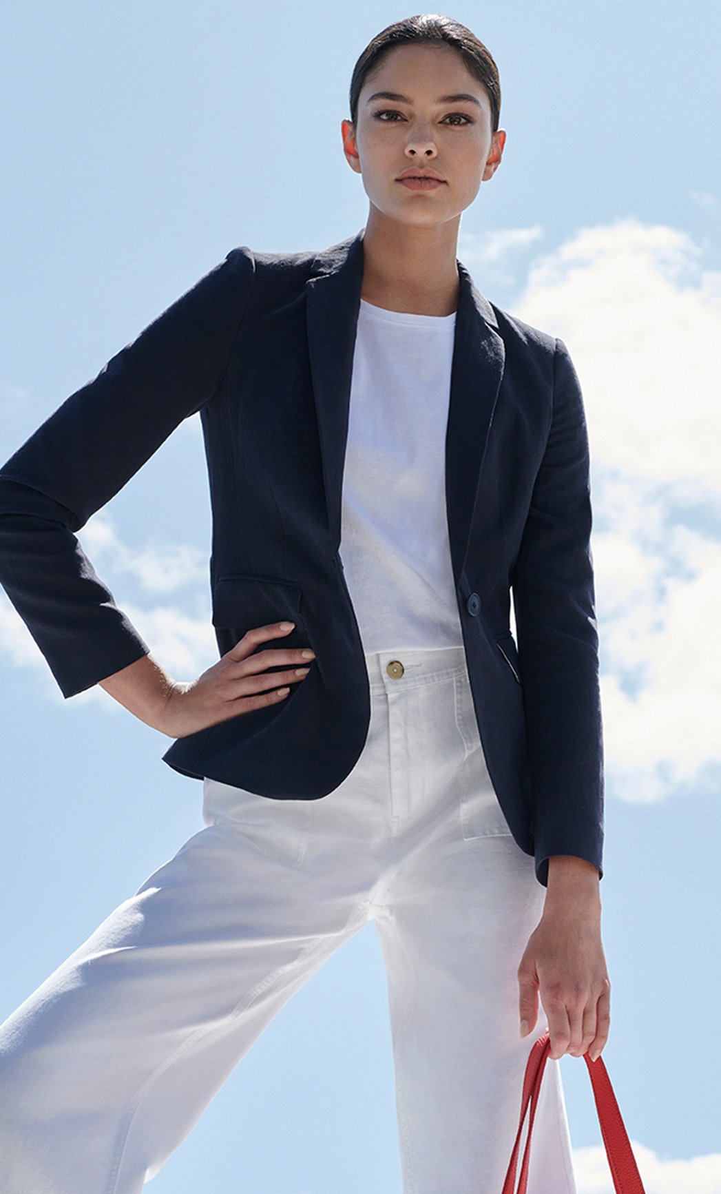 Light layers with navy blazer, with white t shirt and white jeans 