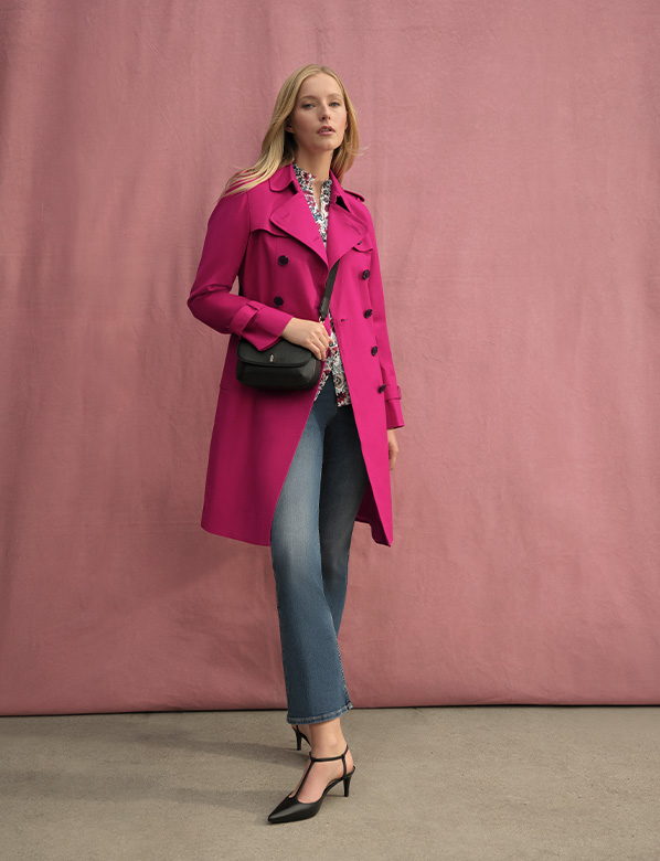 Pink trench coat and blue jeans