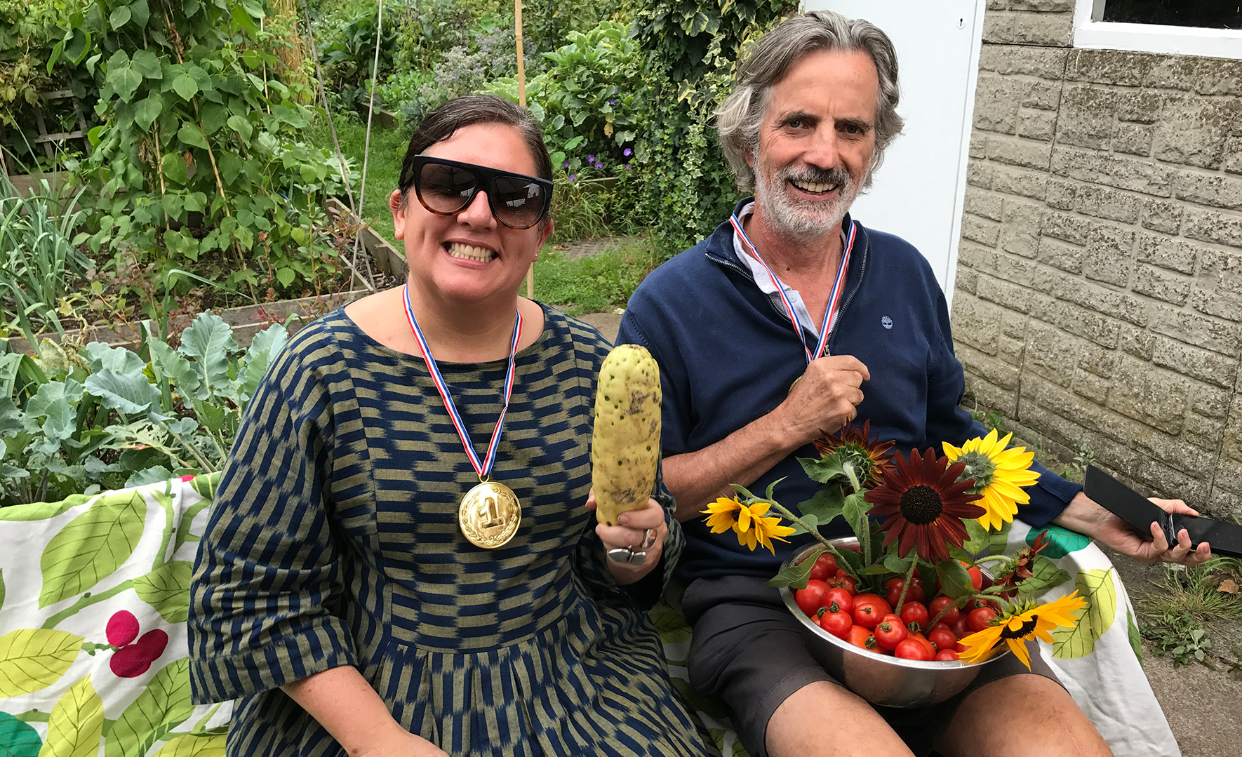 Rosarie and a friend show off the fruits of their hard work in thre allotments