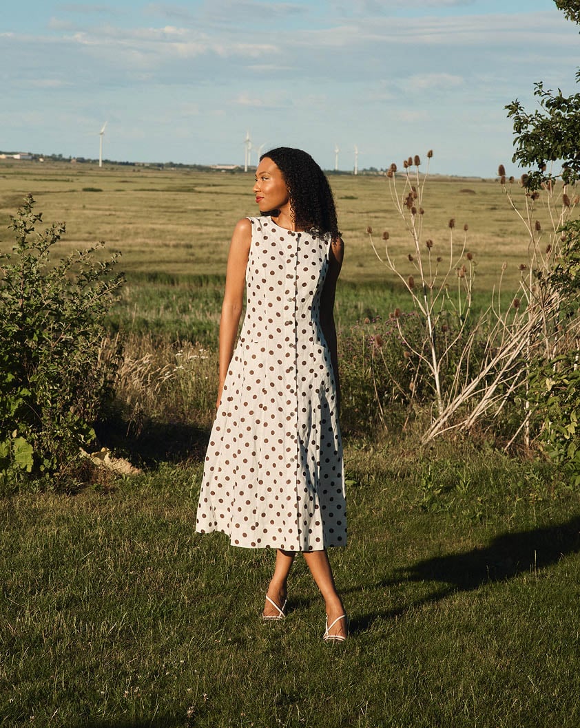 A woman wearing a Hobbs ditsy floral dress.