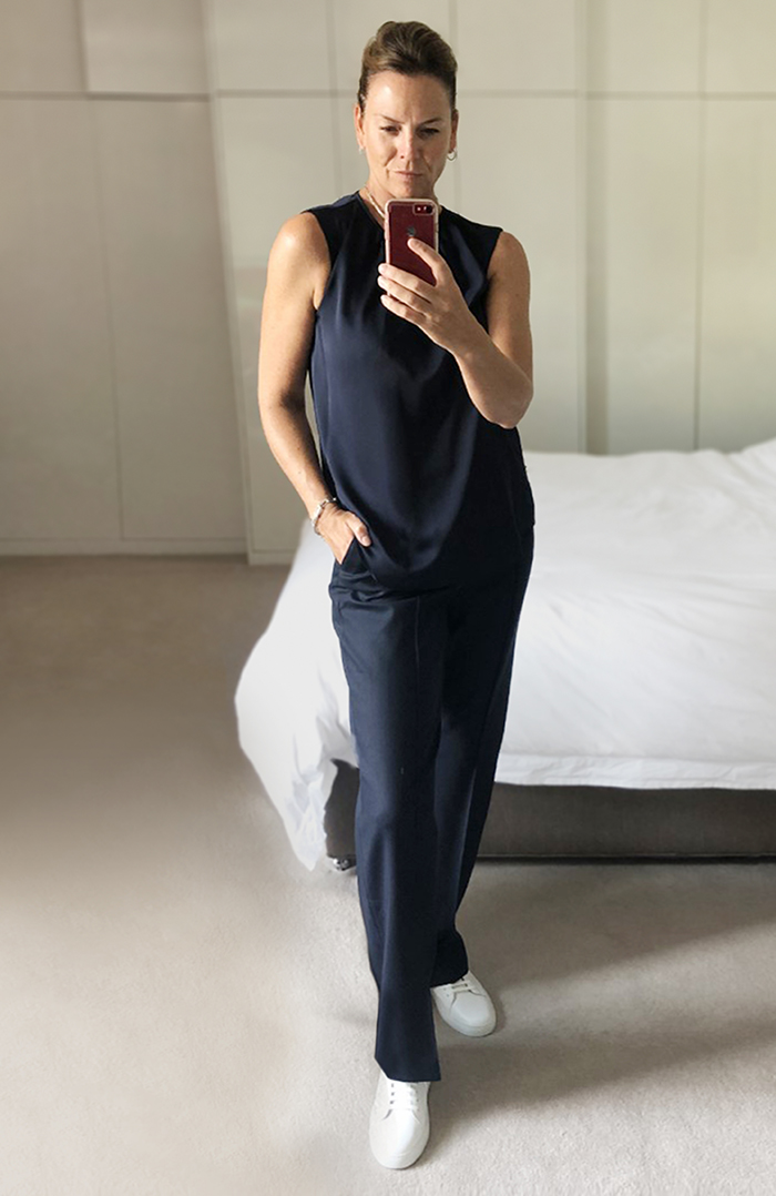 Sally styles the effortlessly chic navy blue satin willow top with navy trousersm for a elegant take on monochrome dressing. 