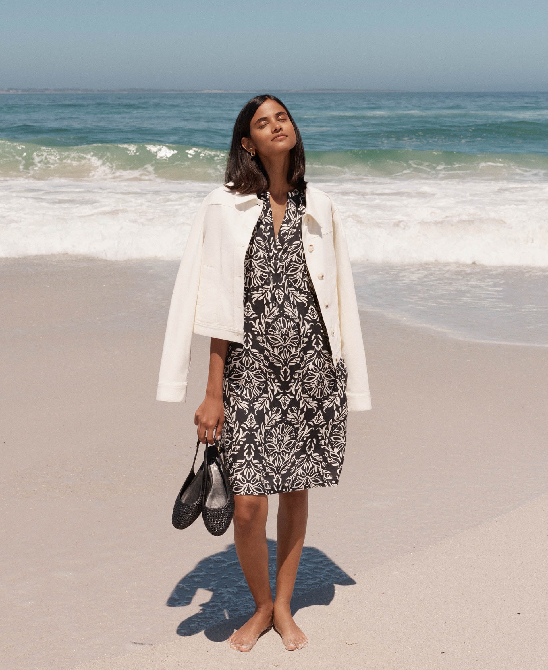 A woman wearing a Hobbs lightweight, cotton jacket.
