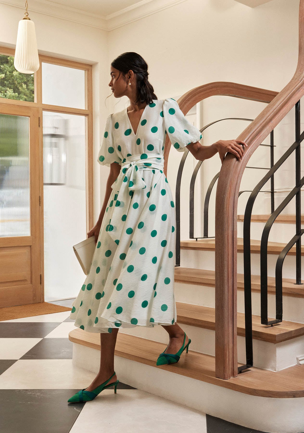 A woman wearing a Hobbs polka dot dress