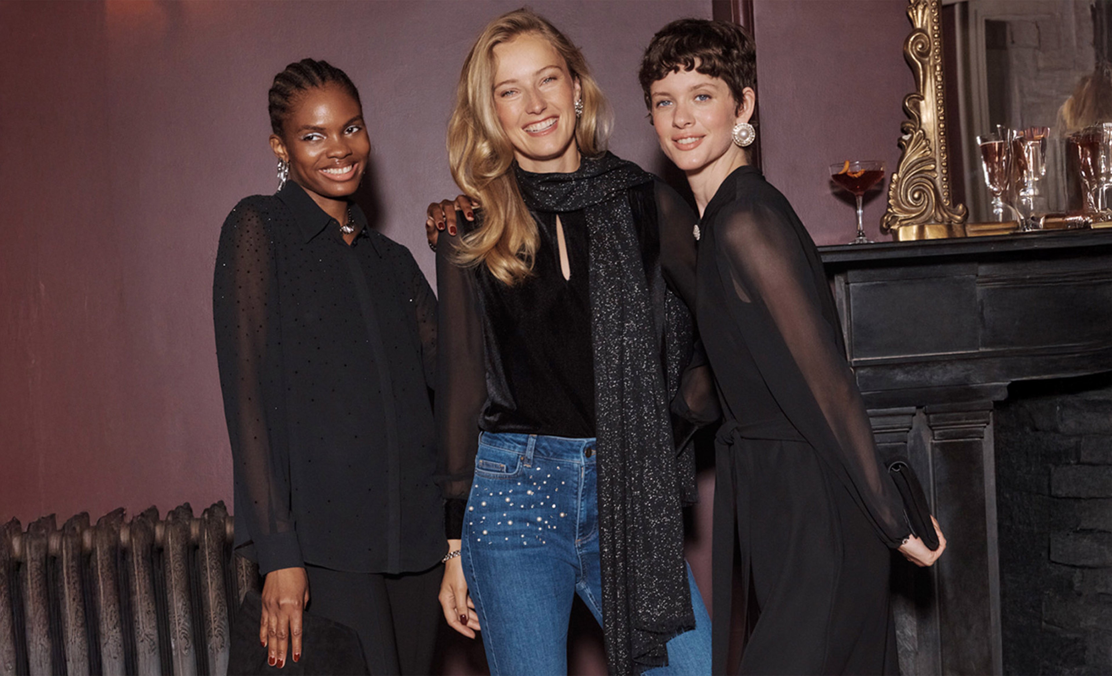 A woman wearing an embroidered Hobbs occasion dress