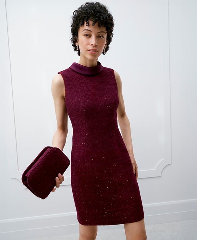 A woman wearing a Hobbs occasion dress and co-ordinating jacket.
