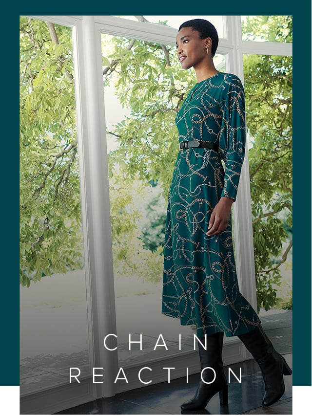 Hobbs Angela Green Chain Print Midi Dress styled with knee high leather boots