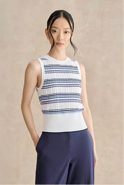 A woman wearing a Hobbs dress.