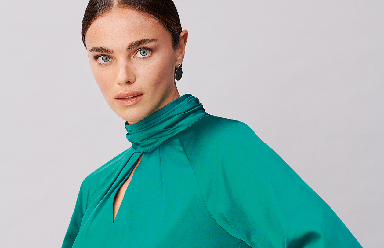 Model wears a satin blouse from Hobbs.