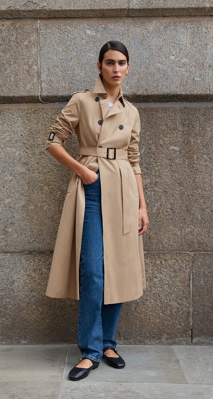 A woman wearing a Hobbs trench coat.