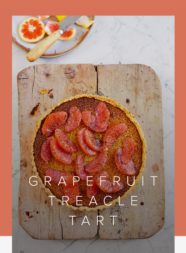 Prue Leith's Grapefruit Treacle Tart on a wooden board