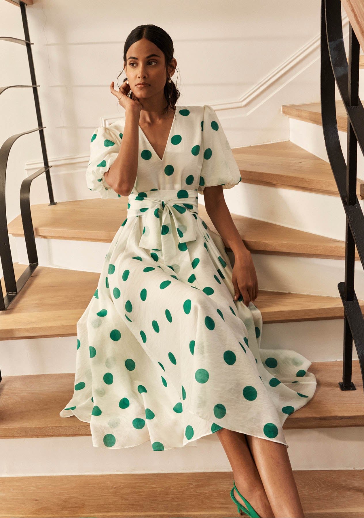 A woman wearing a Hobbs polka dot dress
