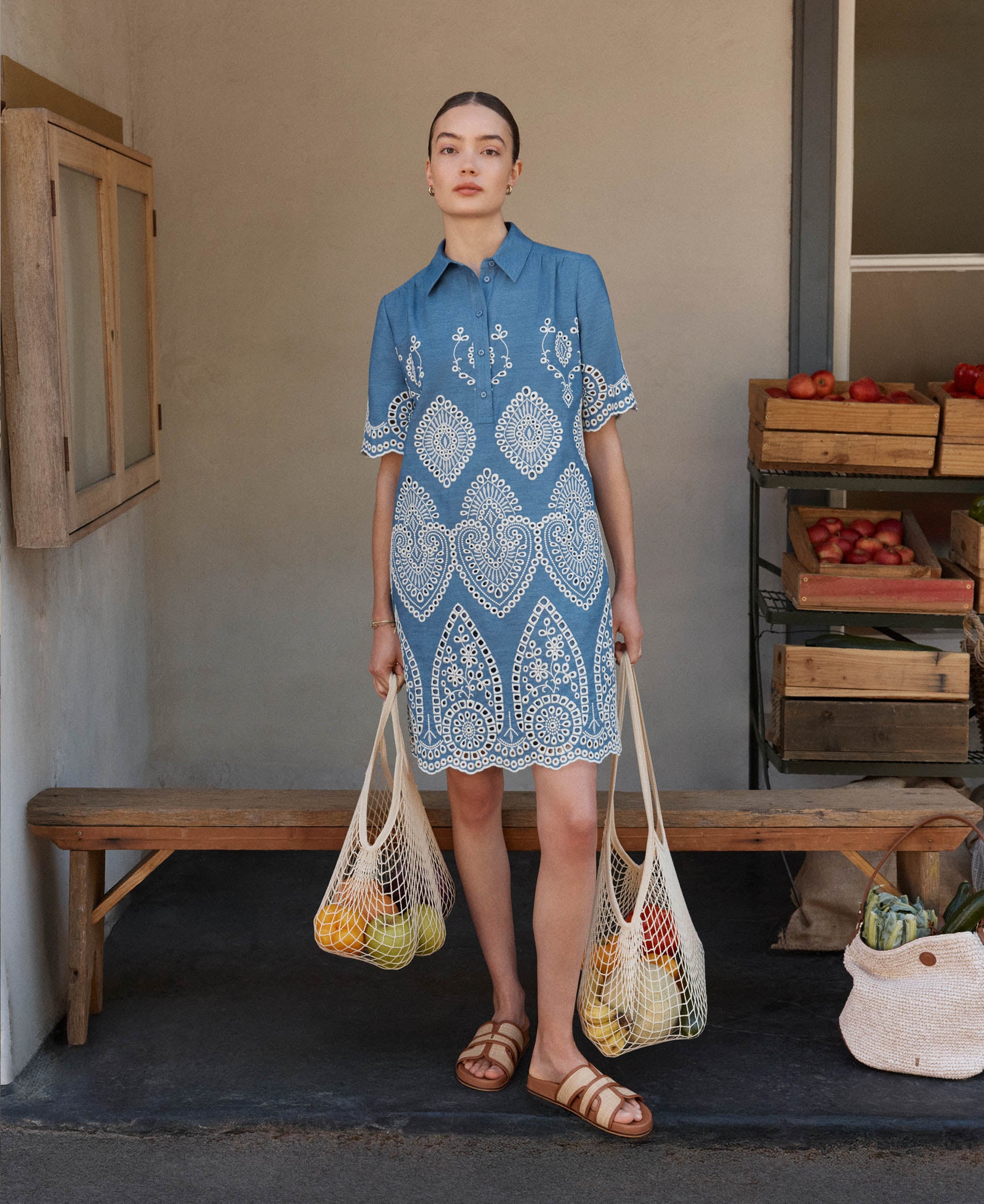 A woman wearing a Hobbs broderie tunic dress