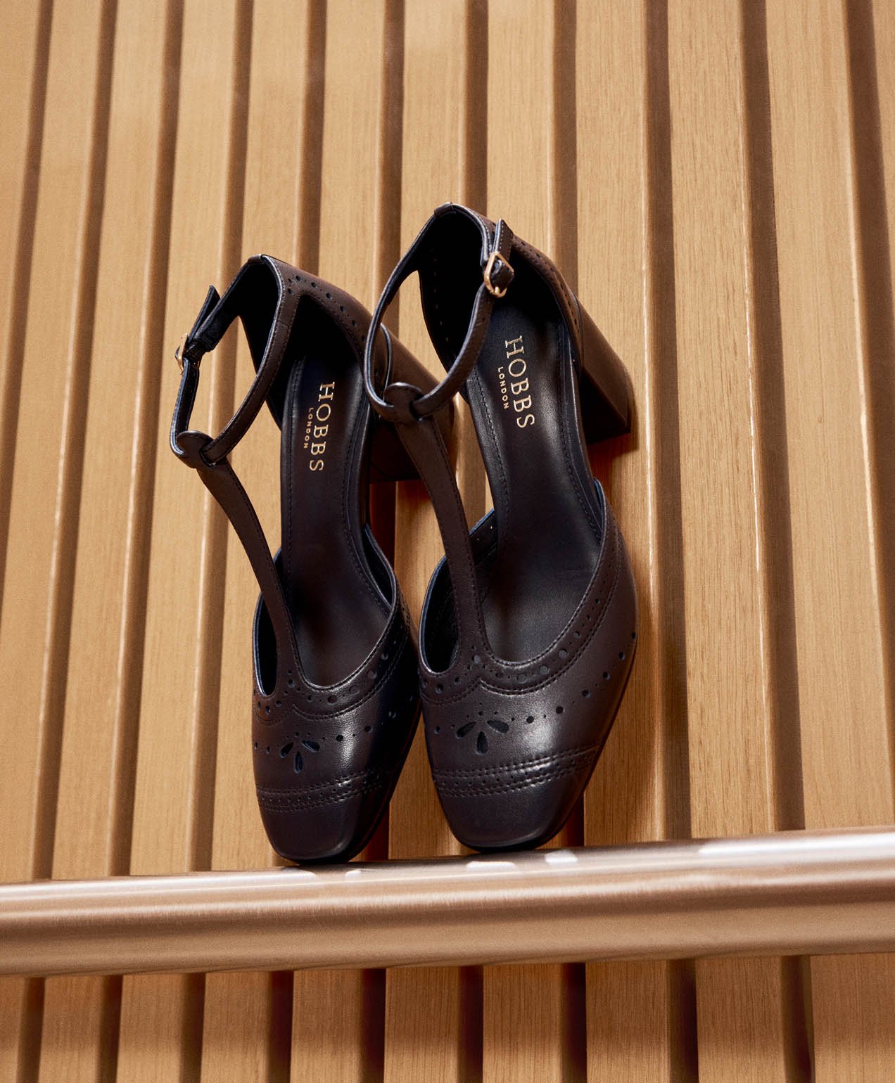 A pair of navy heeled shoes.