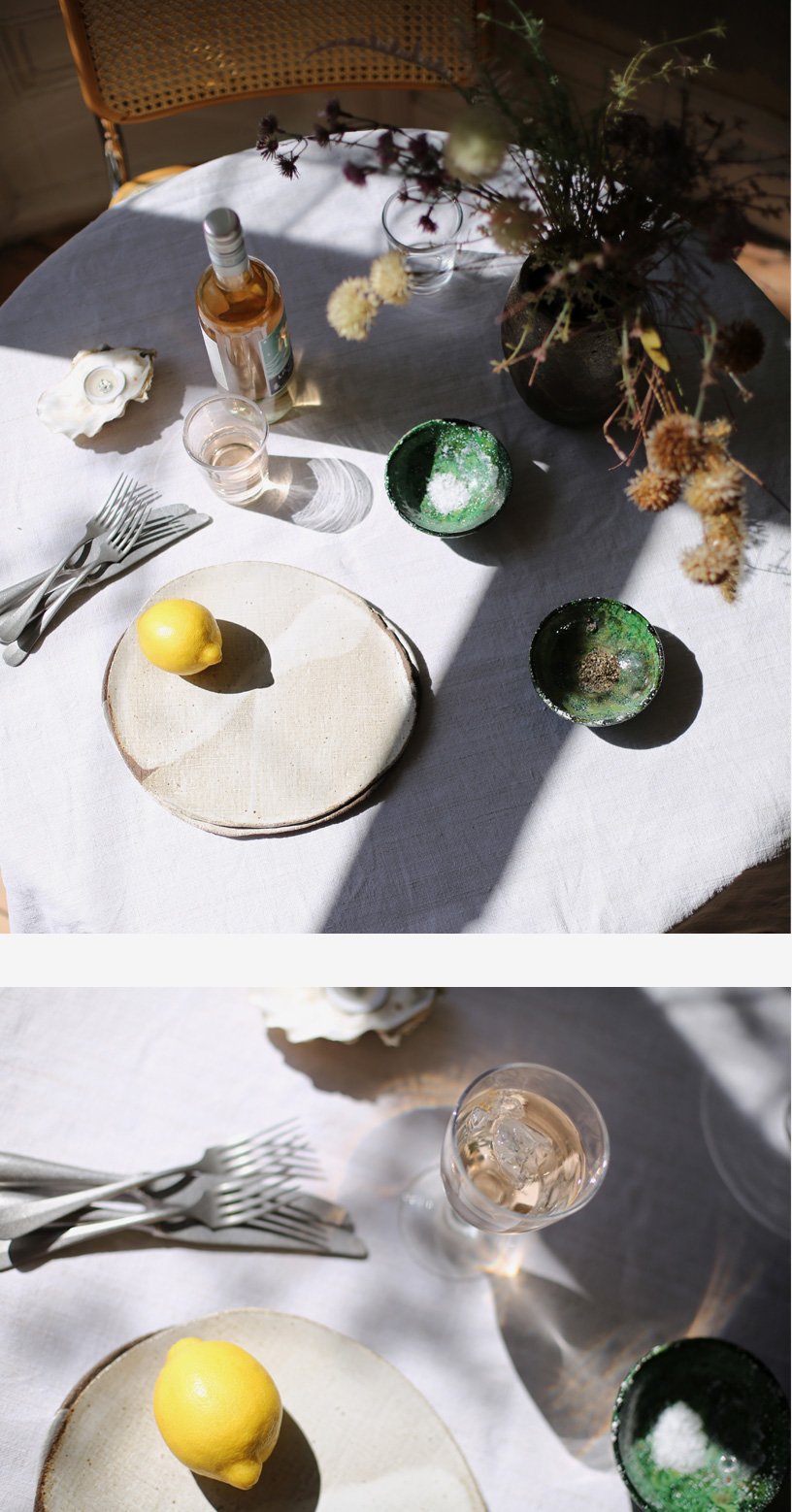 A detail shot of the table setting featuring flowers and green bowls. 